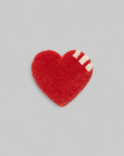 Heart Rug Coaster Red — top-down view showing heart-shaped tufted rug coaster with white stripe detail