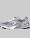 A grey New Balance 993 running shoe with mesh upper, midsole, and logo on the side.
