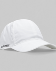 White cap with 'NOCTA' logo on a gray background