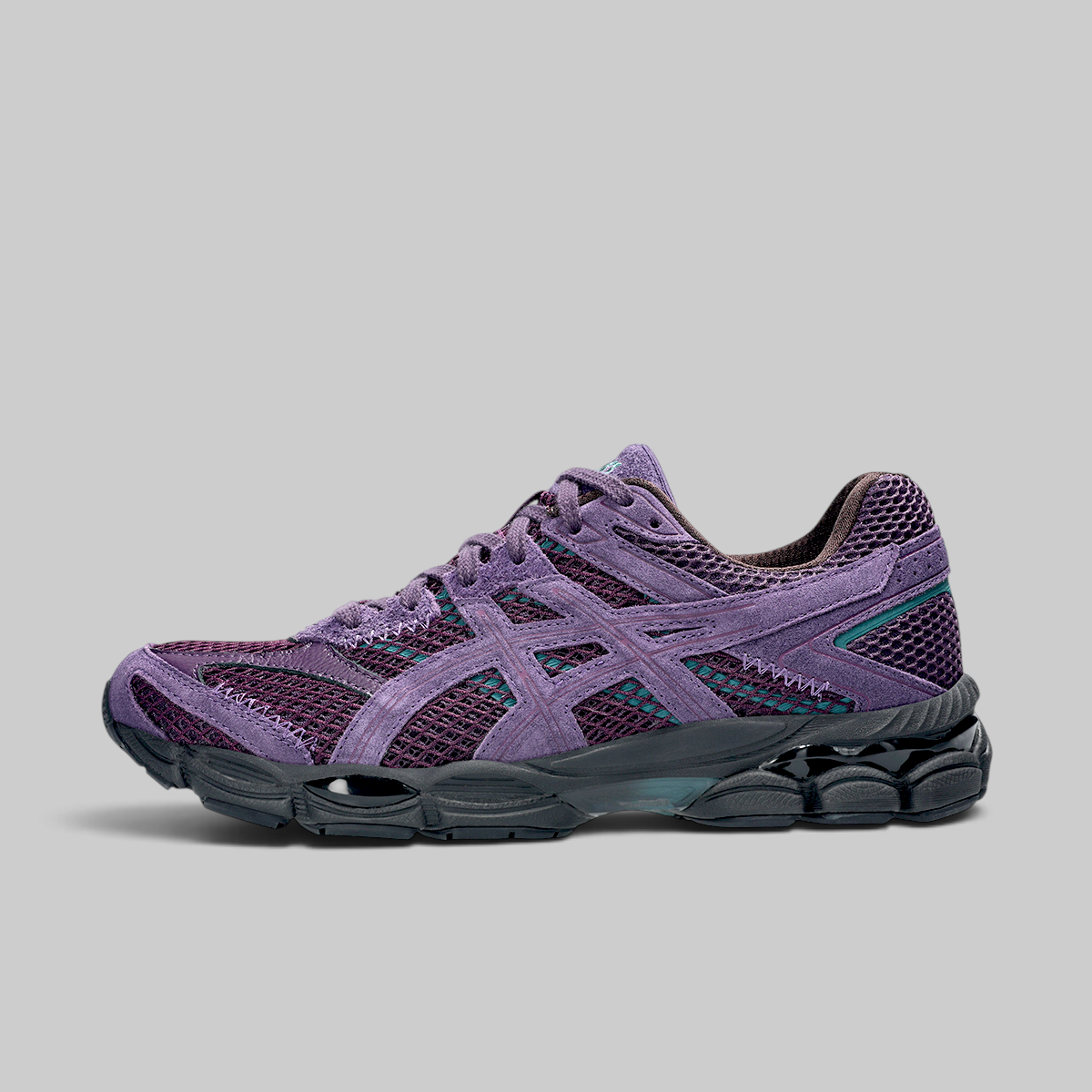 A single ASICS sneaker in purple and dark gray, shown from a side profile against a solid gray background.