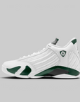 A white and dark green Nike Air Jordan 14 Retro sneaker shown from a side profile view against a solid gray background.