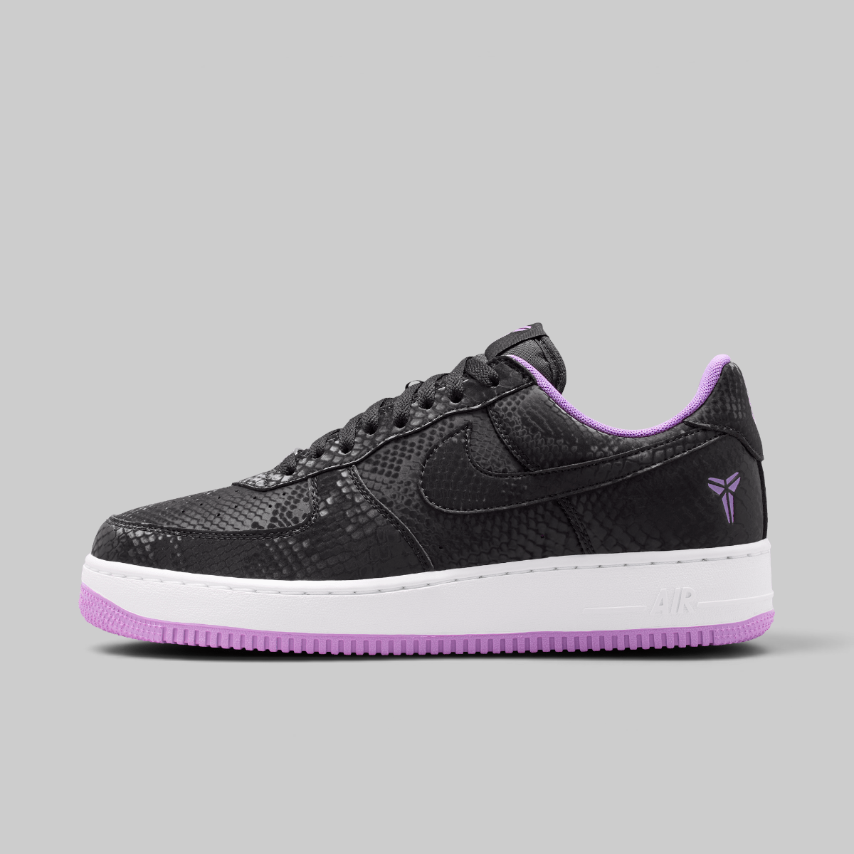 Black and white Nike Air Force 1 sneaker on a light gray background