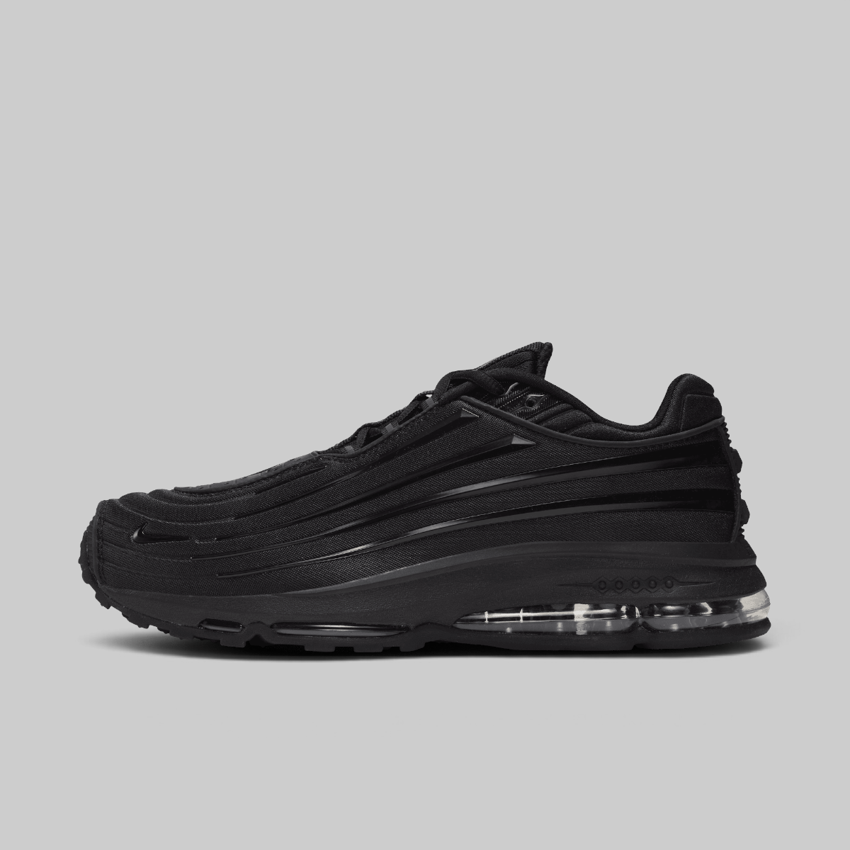 Black sneaker on a light gray background