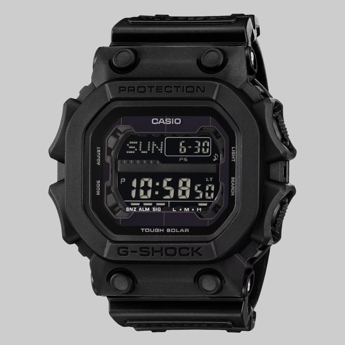 A black Casio G-Shock digital watch with a rugged rectangular case and a dark display showing the time and day, photographed against a solid light gray background.