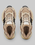 A pair of Pharrell Williams Adistar Jellyfish - "Crystal Sand" sneakers shown from a top-down view on a light gray background. The shoes feature a beige and tan color palette with black accents on the laces and heel areas, and subtle light blue details on the tongue and midsole.