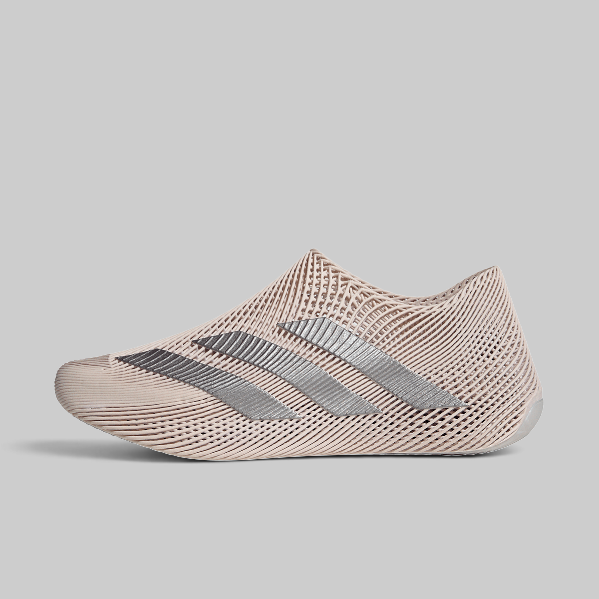A low-top athletic shoe in a light beige mesh knit material with three metallic silver stripes, shown from a side profile on a solid gray background.