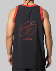 A man shown from the back wearing a black athletic tank top with red trim and a large red signature graphic on the back, photographed against a plain light gray studio background.
