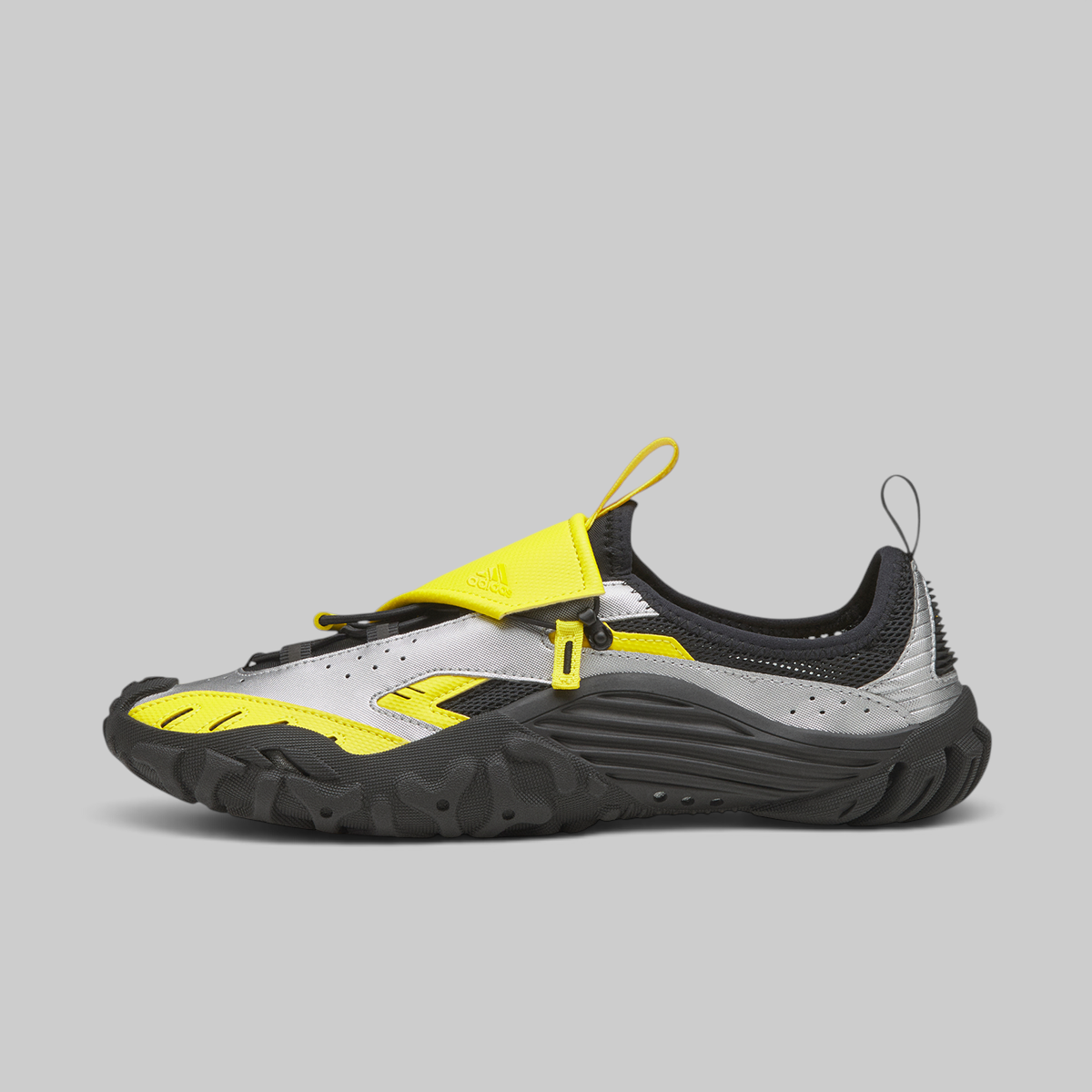 A Reebok water shoe in gray, black, and neon yellow, shown in a side profile on a solid gray background.