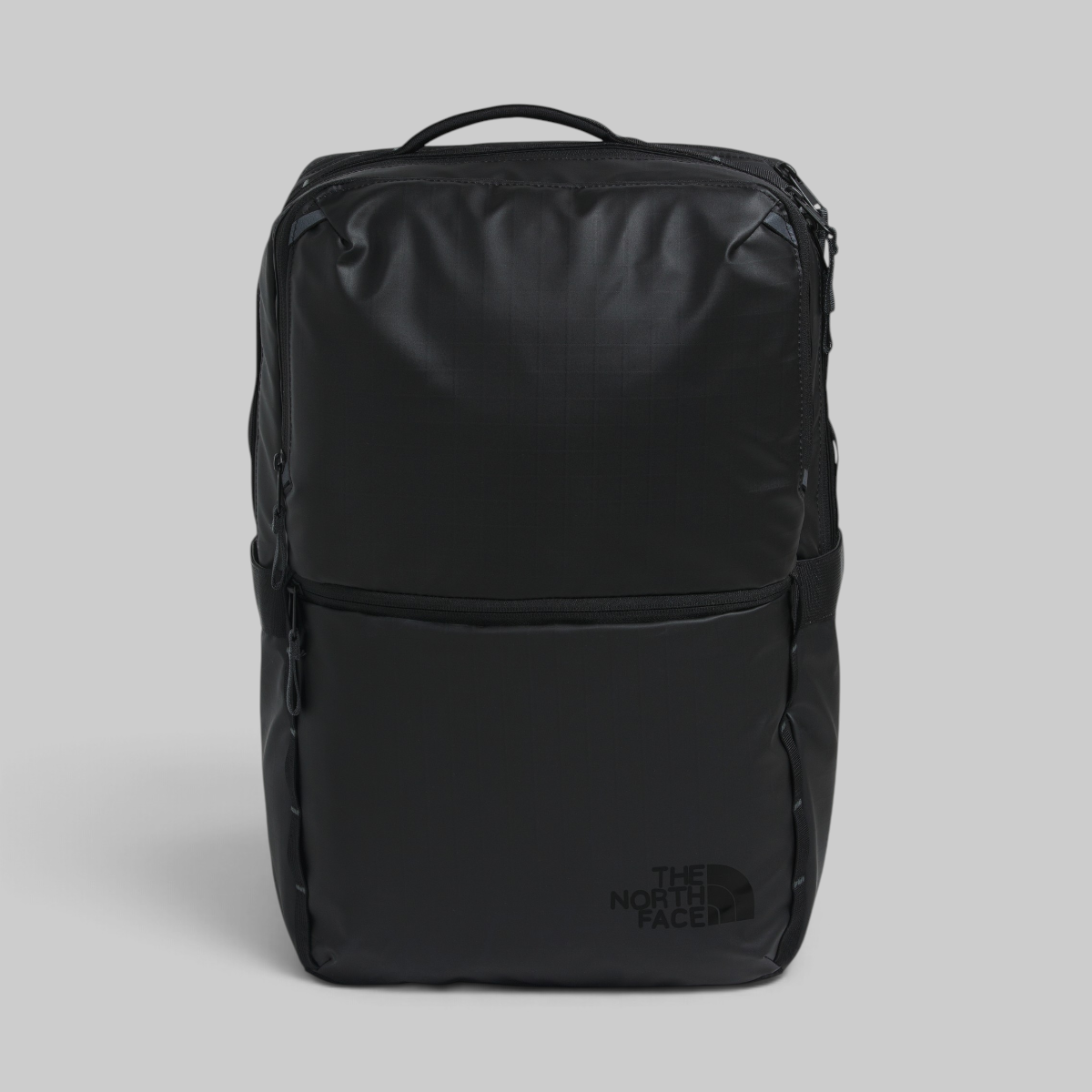 A black The North Face backpack shown from the front against a neutral gray background.